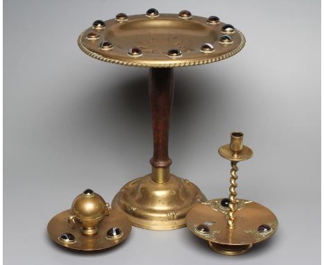 A VICTORIAN BRASS INKWELL of dished circular form, the spherical well with two ring handles on a slightly dished base, inset 