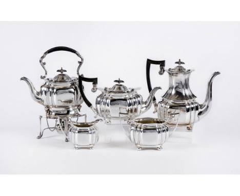 A FOUR PIECE TEA AND COFFEE SERVICE, maker Cooper Bros. & Sons Ltd., Sheffield 1916, of lobed oval form raised upon four bun 