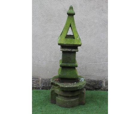 A SANDSTONE FINIAL of square form, the pierced tapering surmount with ogee finial, on ogee moulded base, raised on associated