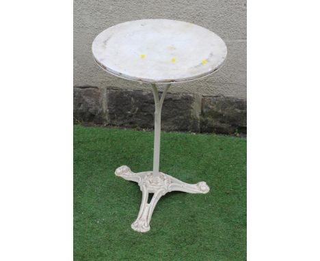 A CAST IRON BISTRO TABLE, the circular white marble top on plain turned stem, raised on scrolled and pierced leaf moulded tri