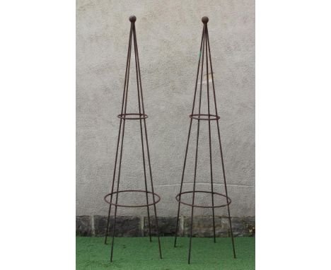 A PAIR OF WROUGHT IRON PLANT OBELISKS of tapering circular form with ball finial, rust patination, 12 1/2" x 88" (Est. plus 2