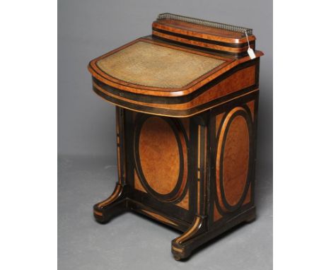 A VICTORIAN YEW AND EBONISED DAVENPORT, the raised stationery compartment with brass gallery on hinged lid, bow front writing