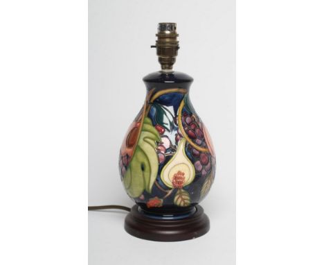 A MOORCROFT POTTERY LAMP BASE, modern, of ovoid form, tubelined and painted in colours with the Queens Choice pattern designe