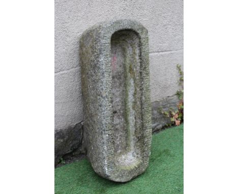 A GRANITE TROUGH of well cut narrow oblong form with rounded ends, 32" x 12" x 8 1/2" (Est. plus 24% premium inc. VAT)Very go