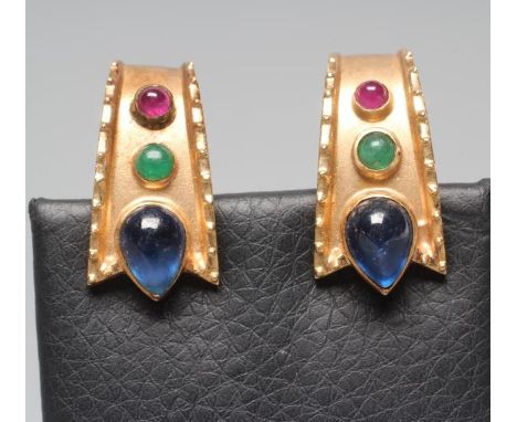 A PAIR OF MODERNIST STYLE FRENCH CLIP EARRINGS, the flared oblong panels with rope twist borders enclosing a cabochon polishe