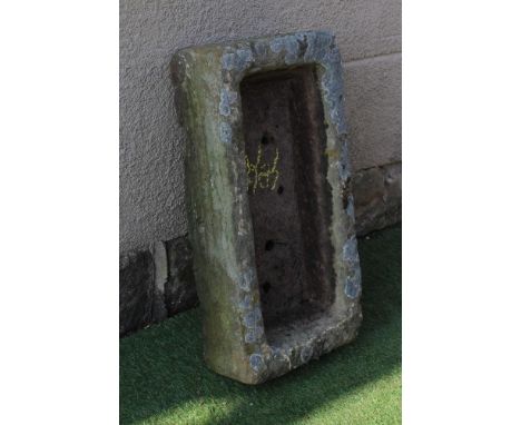 A SANDSTONE TROUGH of rough hewn oblong form, 27 1/2" x 13 1/2" x 72" (Est. plus 24% premium inc. VAT)Very good