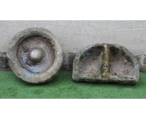 A SANDSTONE TROUGH of rough hewn circular form, the shallow interior with central boss, 22 1/2" x 7", together with a D shape