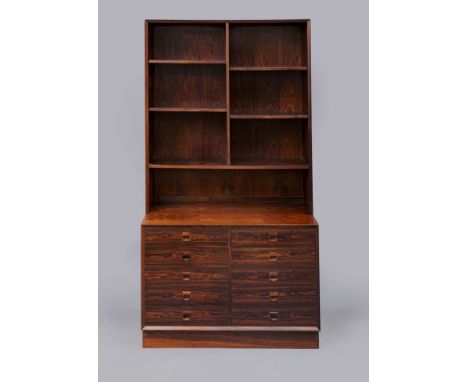 A ROSEWOOD TWO STAGE BOOKCASE, mid 20th century, the upper section with straight top and chamfered edging enclosing adjustabl