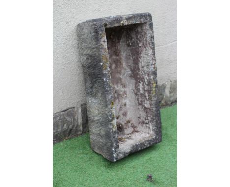A SANDSTONE TROUGH of well cut oblong form with tapering sides, 33" x 17 1/2" x 10" (Est. plus 24% premium inc. VAT)Generally