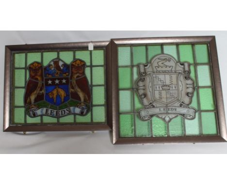 A STAINED GLASS PANEL DEPICTING THE ARMS OF THE CITY OF LEEDS, 20th century, within a plain green glass surround, 20" x 25 1/
