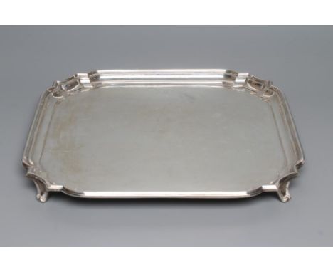 A SALVER, maker Wm. Haseler, Sheffield 1943, of canted square form with pie-crust rim, raised upon four out-curved feet, 12" 