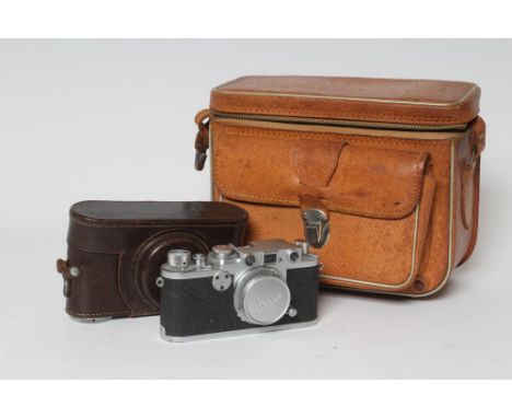 A LEICA 11F RED DIAL CAMERA, 1952, numbered 762067, with 39th ed. Guide by W. D. Emanuel, original stitched leather case with