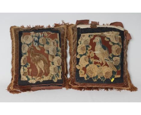 TWO TAPESTRY PANELS, 17th century, both woven in coloured wool with an exotic bird within a foliate border, approximately 15 