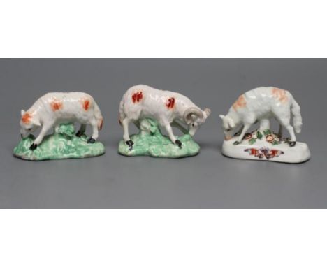 A DERBY PORCELAIN GRAZING EWE, c.1760, standing on a flower enrusted shaped base, the fascia painted with a butterfly, 2 3/4"