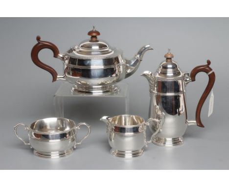 A FOUR PIECE TEA SERVICE, maker Fattorini & Sons, Birmingham 1930 and 1931 (hot water jug), of squat baluster form with a ree