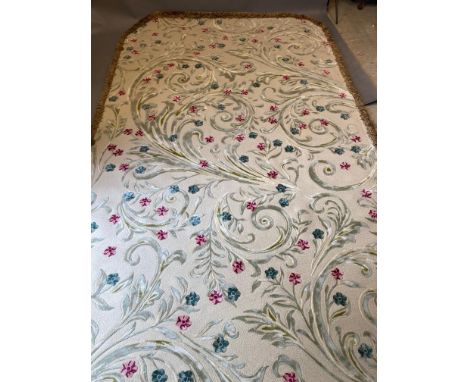 A BESPOKE WOOL FRINGED CARPET manufactured by Concept Handtufting Ltd., in all over cut-pile work with scrolling foliage and 