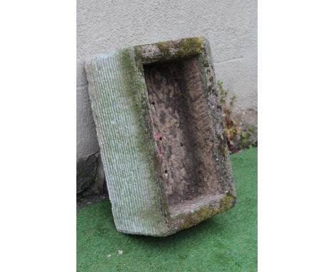 A SANDSTONE TROUGH of well cut oblong form with line banding, 27 1/2" x 17" x 11" (Est. plus 24% premium inc. VAT)Very good
