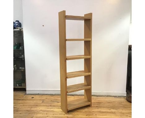 A modern freestanding light oak bookshelf, the rectangular upright supporting six adjustable shelves (204cm x 65cm x 30cm)
