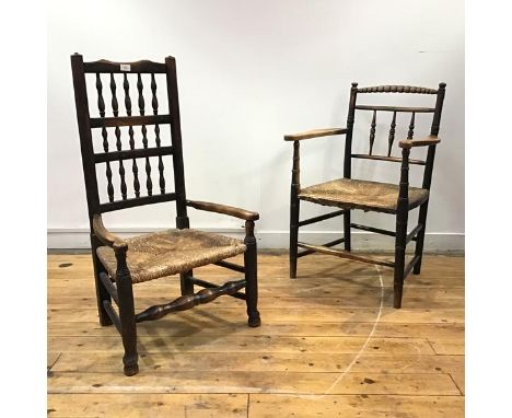 An Arts &amp; Crafts Sussex chair, the bobbin turned top rail and baluster shaped mid rails above a quarter woven seat, raise