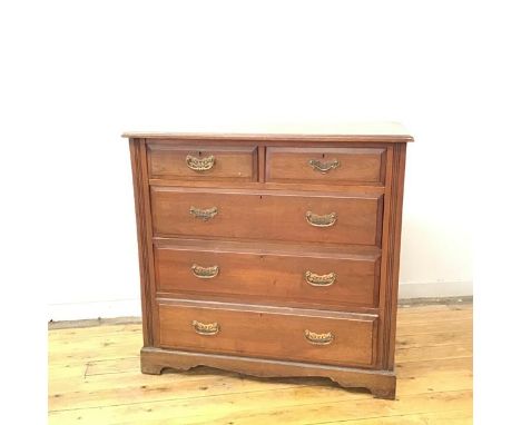 A late Victorian walnut chest, the rectangular top with moulded edge above two short and three long graduated drawers, raised
