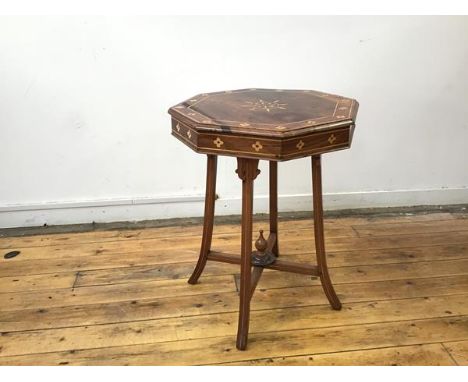 A hardwood and boxwood inlaid occasional table, the octagonal top inlaid with a stylised flower to the centre, with a border 