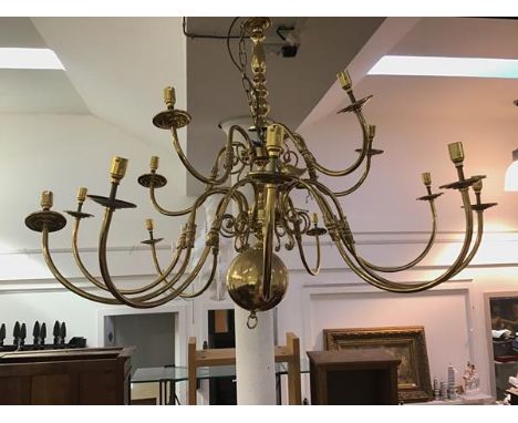A modern brass ceiling pendant in the 17thc Dutch style, the turned shaft radiating fifteen scrolling branches with bulbous p