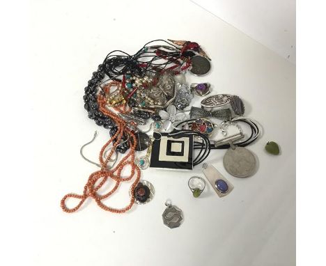 A collection of jewellery including a silver ring with oval cut spinach green stone, a silver pendant set with opaque stone, 