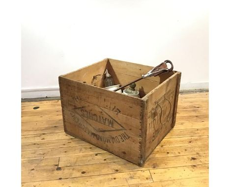 A large wooden storage box, by the Take me Match Company, London, with rope handles, enclosing various items to include three