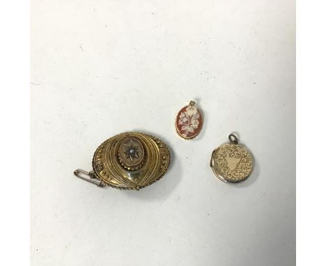 A 9ct gold locket with engraved foliate decoration (d.2cm) (4.25g) , a carved shell cameo depicting a flower spray with Lucy 