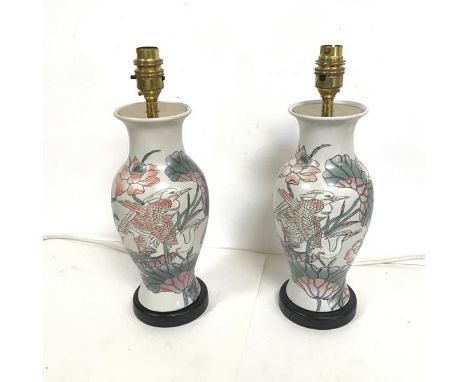 A pair of table lamps of baluster form, with Japanese style decoration of birds, ginkgo biloba and lotus leaves (h.34cm to to