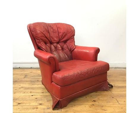A 1970s red vinyl upholstered button back armchair, the padded back, arms and seat with detachable cushions, raised on square