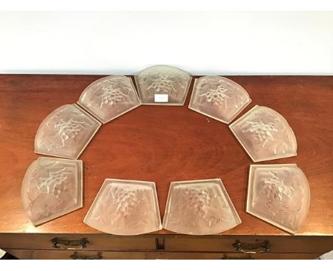Nine Art Deco moulded glass panels by Noverdy, France, each decorated with vines and grapes, formerly part of a light fitting
