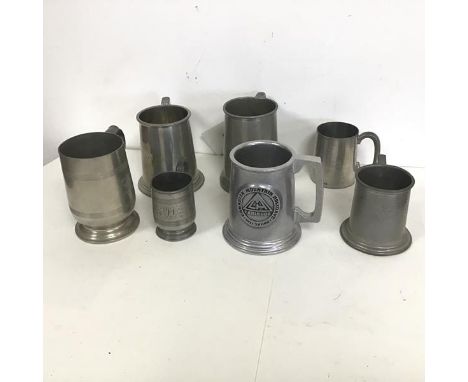 A collection of pewter mugs including those engraved RMS Viceroy of India, Canadian Mountain Holidays, Capetown Castle and El