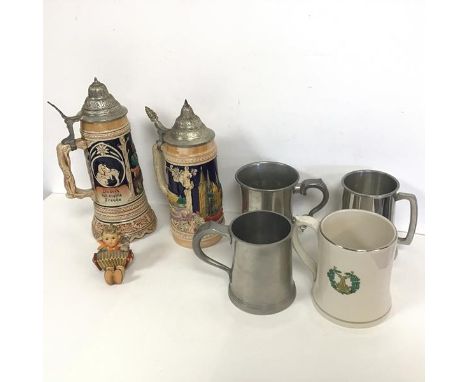 A mixed lot comprising two German ceramic beer steins, with metal lids, one includes music box, a W. Goebel figure of a Boy P