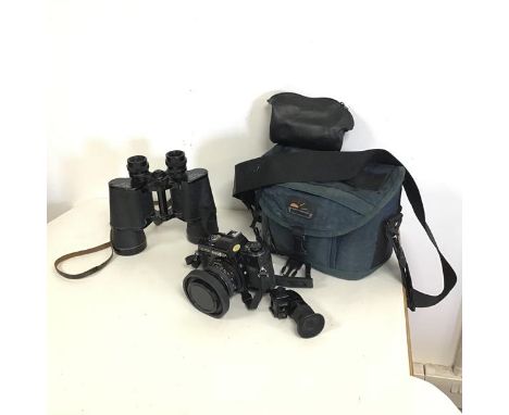 A Minolta X-700 camera with original instruction manual and a Hahnel carrying case, also a pair of Frank-Nipole binoculars (2