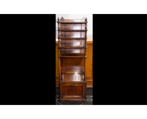 An Unusual Late Victorian Mahogany What-Not In The Gothic Revival Style Comprising six graduating shelves between turned supp