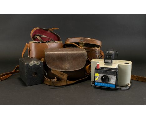 A Small Collection Of Binoculars And Cameras To include Polaroid Swinger II Land Camera, Kodak No. 0 Brownie Camera Model A, 