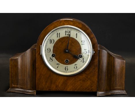 Art Deco Walnut Finish Mantel Clock Silver chapter dial with Arabic numerals, stepped sides on a plinth base, striking on bel