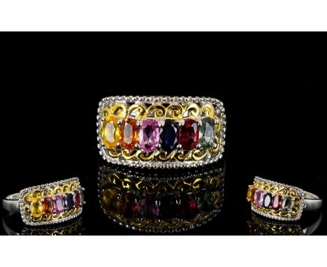 Multi Colour Sapphire Ring, a row of oval cut sapphires, a solitaire of each, green, sunset, blue, pink, orange and yellow, t