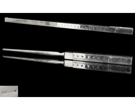 Christian Dior Combination Ruler Paper Knife And Lighter In silver plate of cube form in three sections, length 40 cm. Marked