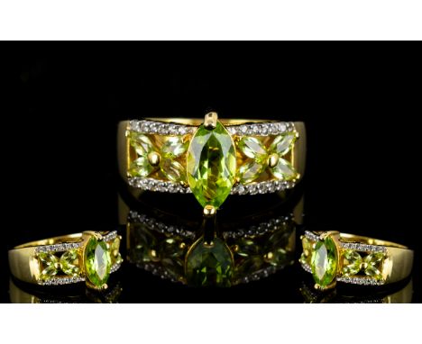 Peridot and White Zircon Band Ring, a 1.8ct marquise cut peridot set above the openwork part of the 14ct gold vermeil band, w