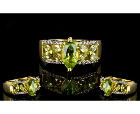 Peridot and White Zircon Band Ring, a 1.8ct marquise cut peridot set above the openwork part of the 14ct gold vermeil band, w