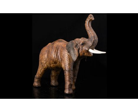 Antique Leather Model Of An Elephant, Realistically Modelled, trunk up. Height 12 inches, please see accompanying image.