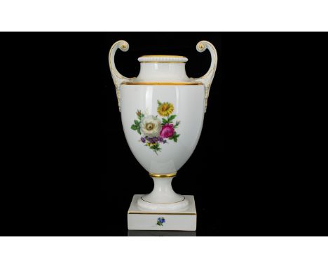 A German Furstenberg Porcelain Urn Vase Numbered 02363 7 Twin handle vase raised on square base with floral posy transfer pri