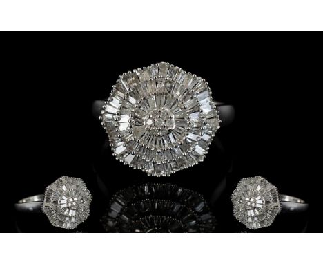 Diamond Rosette Cluster Ring, three wavy tiers of closely set baguette cut diamonds, centred by a small cluster of round cuts