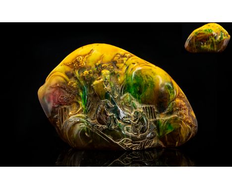 Large Carved Amber Style Oriental Boulder The front depicting scholars amongst prunus blossom, the whole in yellow, green and