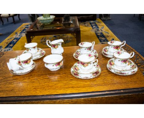 Royal Albert 'Old Country Roses' Part Tea Service to include 7 cups, 7 saucers, 5 sandwich plates, a sugar bowl and milk jug.