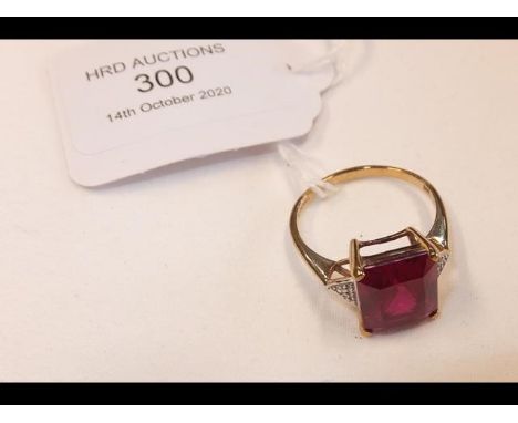 A red stone lady's dress ring in 9ct gold setting 