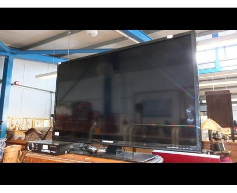 A Blaupunkt 40 inch flatscreen TV complete with remote and Technomate projector