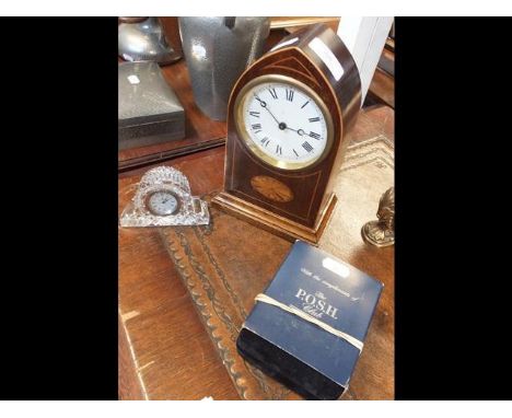 An Edwardian mantel clock, together with a bedside clock and two silver napkin rings 